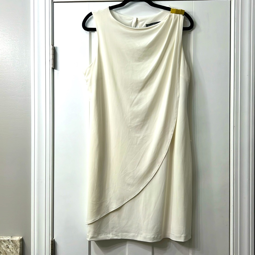 Classy sleeveless cocktail dress with gold ‘clip’; perfect for nice dinner date